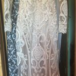 Allure Bridal  Wedding Dress Style; F239 Andi Was altered to fit me at 5’2. The dress does have a few small tears in the train which are pictured. A bustle was added to the dress the train can be tied up. Any extra fabric from being altered was also saved. Photo 9