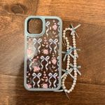 iPhone 14 EUC Floral Bow Phone Case with Pearl Bracelet Accessory Blue Photo 0