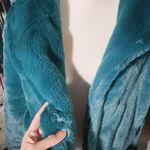 The Comfy rain + rose TEAL GREEN faux fur long sleeve jacket with pockets soft warm New with tag  Smoke and pets free  Same day shipping Faux fur: No ANIMALS WERE HARMED IN THE MAKING OF THIS FASHION THIS GARMENT HAS BEEN HANDCRAFTED BY Rain + Rose STAFF FOR YOUR COMFORT Photo 7