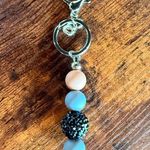 Handmade Elegant Beaded Keychain with Silver Details Photo 2