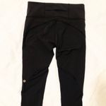 Lululemon RARE Black Lulu Lemon Leggings with Gold Logo Photo 1