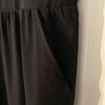 Apt. 9  Jumpsuit size L beautiful kind of silky feelings color black inseam is 26” Photo 6