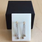 Dangling star earrings Silver Photo 0