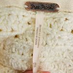 Free People cream colored slouchy turtleneck high low hem Skyscraper sweater. S Photo 10