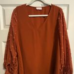 Pink Lily Burnt Orange Puffy Sleeve Blouse Photo 0