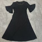 Donna Karan  black dress with bell short sleeves and metal detail neck size‎ M Photo 0