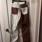 Top Shop Jeans that are a brown and off white color size women’s 28! Photo 3