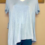Lisa Rinna Asymmetrical Light Blue Shirt Horizontal and Lace Accents Photo 0