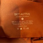 Set Active Salomon Pink Ribbed Side Cropped Athletic Yoga Leggings Size Medium Photo 3