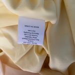 Buttery yellow tight fitting dress Photo 5