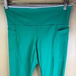 Athleta  Revelation Laser Cut Kelly Green Powervita 25" Leggings Pockets Size M Photo 3