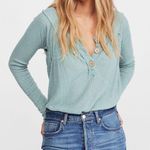 Free People  Must Have Thermal Ribbed Relaxed Henley Top in Bright Aqua Size Med Photo 0
