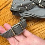 Gray studded faux leather cross body bag. Magnetic snaps on the front. Photo 4