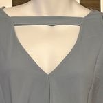 Lisa Rinna Asymmetrical Light Blue Shirt Horizontal and Lace Accents Photo 5