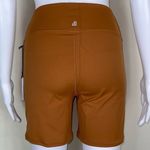 We Wore What ‎ Nylon Biker Short in Gold Photo 4