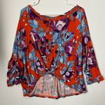 Free People Keepin' On floral slouchy top in orange and purple Photo 1