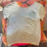 Ariana Grande positions tour merch off shoulder white t shirt Photo 4