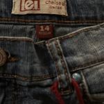 Stylish blue denim shorts with a trendy distressed look. Perfect for casual outings. Size 14 Photo 2