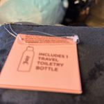 Juicy Couture new tags. I cannot open up the inside or it will cut the tag off. Photo 3