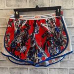 Nike Women’s  Dri-fit Orange blue and white floral print lined athletic shorts M Photo 0