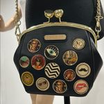 Nicole Lee Black Crossbody Bag with Gold Chain and Decorative Patches Photo 0