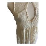 Free People -DONT YOU DARE Stunning cream color lace dress, sleeveless, lined, front keyhole opening, V back, skirt has some gold shimmer, excellent condition, size XS Measurements: Bust: armpit to armpit 15 inches Length: shoulder seam to bottom 33 inches Photo 5