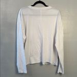 Pact women’s long sleeve front pocket Tee. White size extra large. Photo 3