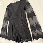 Pretty Little Thing  Bell Sleeve Lace Romper Plunge Neckline Women’s 6 Black Sexy Photo 1