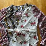 Gimmicks by BKE Gimmicks Floral and Snake Print Wrap Top Photo 0