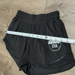 Lululemon Hotty Hot Short 4" Black Running Shorts OVA Logo Size 4 Tall Photo 7