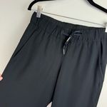 Lululemon  On the Fly Crop Pants Sz 4 Womens Black Travel Woven Mid Rise Photo 7