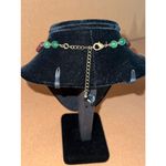 Avon SAQ brass medallion pendant necklace with green and brown beads 18 in VTG Photo 1