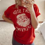 Amazon Holiday Santa Don’t Stop Believing Graphic T-Shirt Photo 0