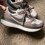 Nike Phoenix Waffle women's sneakers in a mink brown/phantom colorway. Photo 1