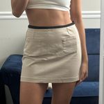 H&M khaki tan high waisted tailored mini skirt with black waist lining detail Photo 0