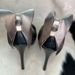 Elle bow on back of the black faux leather platform heels Size 7 M stilettos. Photo 8
