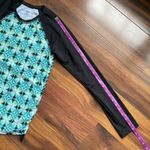 Title Nine  Rash Guard Side Scrunch Tie Black and Blue Two Sided Geometric Shapes Photo 8