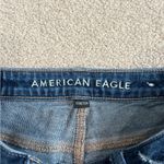 American Eagle  dark wash blue high rise distressed tomgirl button front jeans Photo 5