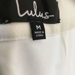 Lulus Lulu’s jumpsuit Clareese White Swiss dot ruffled long sleeve jumpsuit Medium NWT Photo 5