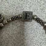 Silver elastic bracelet E charm, heart wings charm Photo 1