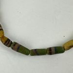 African Sand Cast Glass Trade Beads Handmade Green Earthtone Brown on Grass Photo 1