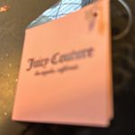 Juicy Couture new tags. I cannot open up the inside or it will cut the tag off. Photo 4