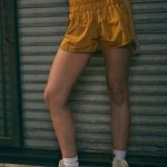 Free People  Movement The Way Home High Waisted Shorts in Gold Photo 1