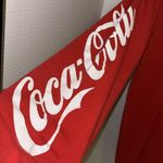Coca-Cola  RED LONG SLEEVE TEE SHIRT
WITH GRAPHIC DESIGN ON FRONT SIZE MEDIUM Photo 2