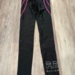 P.E Nation Centre Mark Leggings are a size XS. Black Photo 2