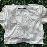 Alphalete Short Sleeve Cream Tee Photo 0