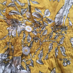 Flower print dress with smocking at the waist. This XL size dress is 100% rayon. Gold Photo 2