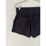 Athleta  Black Pull In Athletic Shorts Zipper Pockets Women’s Size 6 Photo 3