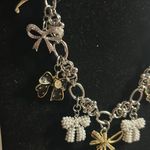 Elegant Silver and Gold Bow Necklace Photo 2