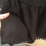 Black Crisscross Back Flowy Top Size L Photo 3